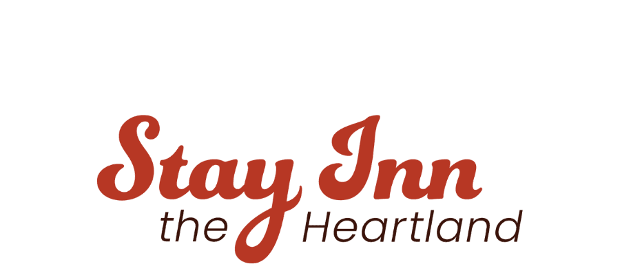 Logo of "Stay Inn the Heartland" featuring stylized text in red.